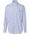 Anchor your wardrobe with elegant indispensables like Polo Ralph Laurens smartly striped dress shirt - Crafted in a pure, blue and white cotton poplin - Classically slim, straight cut - Kent collar, long cuffed sleeves and full button placket - Iconic embroidered polo pony logo at chest - Versatile and polished, a must for both work and weekend - Pair with a suit, or go for a more casual look with chinos and jeans