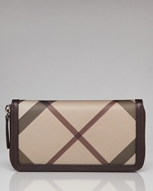 This Burberry wallet keeps the essentials in check, classically styled in coated canvas with a well-organized interior and plenty of pockets. This Burberry wallet keeps the essentials in check, classically styled in coated canvas with a well-organized interior and plenty of pockets.
