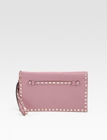 Luxuriously smooth leather accented in shiny pyramid studs with a versatile wrist strap.Wrist strap, 1 dropWristlet, 6 dropMagnetic snap flap closureThree inner compartmentsOne inside zip pocketFully lined11W X 6½H X 1DMade in Italy Luxuriously smooth leather accented in shiny pyramid studs with a versatile wrist strap.Wrist strap, 1 dropWristlet, 6 dropMagnetic snap flap closureThree inner compartmentsOne inside zip pocketFully lined11W X 6½H X 1DMade in Italy