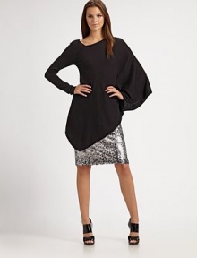 A new angle on a luxurious top, knit of silk and cotton with two different sleeves and a dramatic diagonal hem.Off-center V neckline with exposed seamOne long slim sleeve, one long draped batwing sleeveAngular hemAbout 24¾ from shoulder to hem55% silk/45% cottonDry cleanImported Model shown is 5'9½ (176cm) wearing US size 4. 