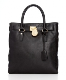 A classic design with elegant appeal, this exquisite tote from MICHAEL Michael Kors is the ultimate accessory. Butter-soft leather and gleaming golden hardware lend a luxe look, while the spacious, pocket-lined interior keeps essentials safe and secure. A classic design with elegant appeal, this exquisite tote from MICHAEL Michael Kors is the ultimate accessory. Butter-soft leather and gleaming golden hardware lend a luxe look, while the spacious, pocket-lined interior keeps essentials safe and secure.
