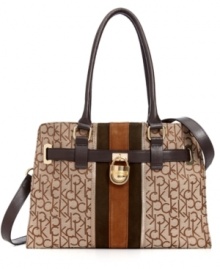 Trimmed and belted with soft leather, this ladylike design from Calvin Klein features signature jacquard and elegant striping. The practical interior, with middle zip compartment and plenty of pockets, makes it an exquisitely organized option. Trimmed and belted with soft leather, this ladylike design from Calvin Klein features signature jacquard and elegant striping. The practical interior, with middle zip compartment and plenty of pockets, makes it an exquisitely organized option.