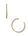 Exude cool in Melinda Marie's hoop earrings made from teeny pod turquoise beads.