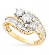 A supremely elegant and feminine diamond ring featuring sparkling round and baguette-cut diamonds (1-1/2 ct. t.w.) in a glamorous bypass style. Set in 14k gold.