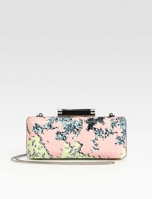 An abstract print accented with sparkling sequins throughout.Concealable chain shoulder strap, 21 dropTop clasp closureOne inside open pocketFully lined8W X 3½H X 1½DImported An abstract print accented with sparkling sequins throughout.Concealable chain shoulder strap, 21 dropTop clasp closureOne inside open pocketFully lined8W X 3½H X 1½DImported