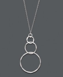 Light and airy, this subtle style perfects any look. Studio Silver's pretty pendant features three graduated, interlocking rings in sterling silver. Approximate length: 16 inches. Approximate drop: 1-3/4 inches.