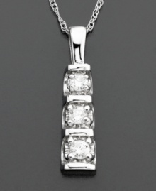 The perfect expression of elegance. Three round-cut diamonds (1/5 ct. t.w.) form a column of sparkle on this beautiful pendant, set in 14k white gold. Chain measures 18 inches; drop measures 3/4 inch. The perfect expression of elegance. Three round-cut diamonds (1/5 ct. t.w.) form a column of sparkle on this beautiful pendant, set in 14k white gold. Chain measures 18 inches; drop measures 3/4 inch.