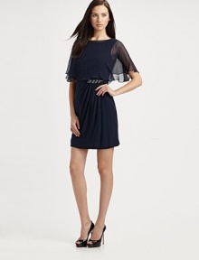 A classic shift, made elegant by asymmetrical ruching, jewel details, and an airy, sheer capelet overlay.Sleeveless Attached sheer capelet with back hook closure Ruched side drape with jeweled detail V back with concealed back zip About 21 from natural waist Fully Lined Silk Dry Clean Imported A classic shift, made elegant by asymmetrical ruching, jewel details, and an airy, sheer capelet overlay.Sleeveless Attached sheer capelet with back hook closure Ruched side drape with jeweled detail V back with concealed back zip About 21 from natural waist Fully Lined Silk Dry Clean Imported