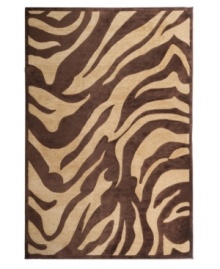 A dramatic zebra print indulges your flair for the exotic, enlivening your space with a chic, contemporary allure. Designed for easy care and long-lasting wear, this striking area rug from Surya will maintain its plush texture even in high-traffic areas.