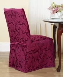 An effortless update and perfect furniture protector, the printed Scroll dining room chair cover from Sure Fit features a draped skirt with back ties for a sleek fit over any style furniture. An effortless update and perfect furniture protector, the printed Scroll dining room chair cover from Sure Fit features a draped skirt with back ties for a sleek fit over any style furniture.