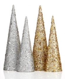 Simply dazzling, these streamlined trees set the scene for a festive holiday with silver glitter and sequins.