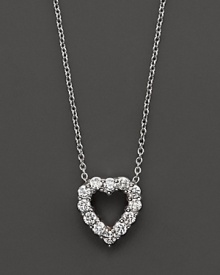 From the Tiny Treasures collection, a diamond heart necklace with signature ruby accent. Designed by Roberto Coin.