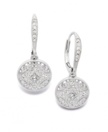 Petite and precocious. These elegant Eliot Danori earrings create a magical look with an intricate, cut-out pattern and sparkling crystal accents. Crafted in silver tone mixed metal. Approximate drop: 1/2 inch.