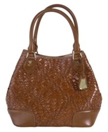 A gorgeous woven design graces this Cole Haan bag for the perfect everyday look. A structured design and polished hardware give this tote a timelessly refined appeal. A gorgeous woven design graces this Cole Haan bag for the perfect everyday look. A structured design and polished hardware give this tote a timelessly refined appeal.