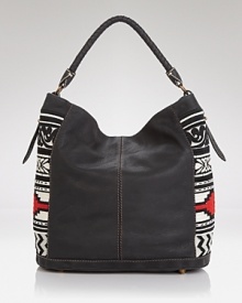 A boho's it-bag for the season: this hobo from Isabella Fiore brings a free spirited vibe to your wardrobe essentials with a mix of buttery leather and tassel detailing.