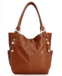 This season, trade your typical structured style for this more laid-back look from Calvin Klein. Buttery-soft leather, low key hardware and plenty of pockets make this tote the perfect work to weekend essential. This season, trade your typical structured style for this more laid-back look from Calvin Klein. Buttery-soft leather, low key hardware and plenty of pockets make this tote the perfect work to weekend essential.