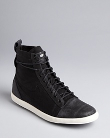 Nike picks up urban style influences in these canvas high top sneakers-meet-booties. Get ready to kick it around town. Nike picks up urban style influences in these canvas high top sneakers-meet-booties. Get ready to kick it around town.