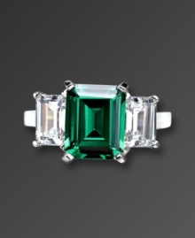 Finish your look with precision style and vibrant color. CRISLU's eye-catching ring highlights an emerald-cut green cubic zirconia center (6 ct. t.w.) with a clear cubic zirconia (2-1/2 ct. t.w.) on either side. Ring crafted in platinum over sterling silver. Sizes 5, 6, 7, 8, and 9. Finish your look with precision style and vibrant color. CRISLU's eye-catching ring highlights an emerald-cut green cubic zirconia center (6 ct. t.w.) with a clear cubic zirconia (2-1/2 ct. t.w.) on either side. Ring crafted in platinum over sterling silver. Sizes 5, 6, 7, 8, and 9.