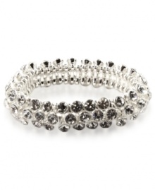 An elegant finishing touch from Anne Klein. Glass and plastic stones in clear hues lend a look of sophistication to this bracelet. Crafted in silver tone mixed metal. Approximate diameter: 2 inches. Stretches to fit wrist.