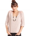 Eyeshadow joins sheer lace insets with easygoing, sweatshirt style on a top that belongs in our closet, stat!