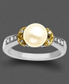 A solitary cultured freshwater pearl (7 mm) surrounded by diamond accents makes for a regal, eye-catching ring. Set in 14k gold and sterling silver. Size 7.