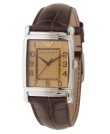 A traditional timepiece with a modern style. Embossed brown leather strap and rectangular stainless steel case. Amber-colored dial with logo at 12 o'clock and brown numerals. Three hands. Quartz movement. Water resistant to 30 meters. Two-year limited warranty. A traditional timepiece with a modern style. Embossed brown leather strap and rectangular stainless steel case. Amber-colored dial with logo at 12 o'clock and brown numerals. Three hands. Quartz movement. Water resistant to 30 meters. Two-year limited warranty.