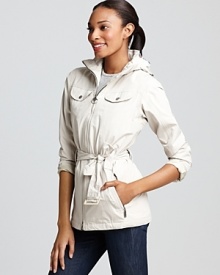 Cut a crisp silhouette in this Barbour hooded rain jacket boasting plenty of pockets and a waist-cinching belt.