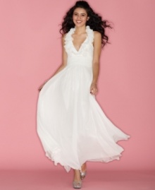 A high, ruffled collar ups the chic factor on this floor-sweeping halter neck gown from B Darlin! A high, ruffled collar ups the chic factor on this floor-sweeping halter neck gown from B Darlin!