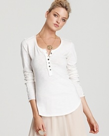 Ruffles and lace lend feminine appeal to Free People's cotton, crochet-embellished henley. Wear it with a full skirt and strappy wedges for a complete look. Ruffles and lace lend feminine appeal to Free People's cotton, crochet-embellished henley. Wear it with a full skirt and strappy wedges for a complete look.
