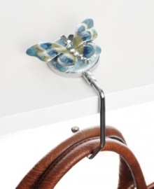 Keep your purse secure (you'll know where it is at all times) and clean (off the floor) with the purse hanger--simply hang on the edge of any table at a restaurant, office or at home. Keep your purse secure (you'll know where it is at all times) and clean (off the floor) with the purse hanger--simply hang on the edge of any table at a restaurant, office or at home.