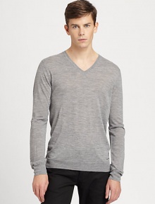 A simple v-neck sweater goes a long way in achieving great style and sophistication and this neatly-shaped rendition is no exception. Knitted from fine merino wool, this pullover is soft and lightweight, making it an ideal choice for seasonal layering.V necklineBanded cuffs and hemMerino woolDry cleanImported