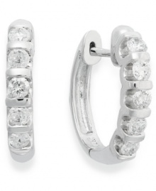 Lighten your look with luminous sparkle. Crafted in 14k white gold, these huggie hoop earrings delight with five, round-cut diamond stations (1/2 ct. t.w.). Approximate drop: 10-1/2 mm. Lighten your look with luminous sparkle. Crafted in 14k white gold, these huggie hoop earrings delight with five, round-cut diamond stations (1/2 ct. t.w.). Approximate drop: 10-1/2 mm.