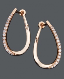 Timeless hoops with an extra pop of sparkle. Crafted in 14k rose gold with a chic oval shape, earrings feature dozens of round-cut diamonds (1/4 ct. t.w.). Approximate diameter: 7/8 inch. Timeless hoops with an extra pop of sparkle. Crafted in 14k rose gold with a chic oval shape, earrings feature dozens of round-cut diamonds (1/4 ct. t.w.). Approximate diameter: 7/8 inch.