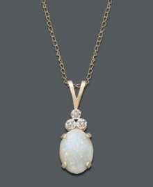 An iridescent sheen adds elegance to any look. Necklace features an oval-cut opal (9/10 ct. t.w.) accented by three, round-cut, diamond accents. Setting and chain crafted in 14k gold. Approximate length: 18 inches. Approximate drop: 3/4 inch. An iridescent sheen adds elegance to any look. Necklace features an oval-cut opal (9/10 ct. t.w.) accented by three, round-cut, diamond accents. Setting and chain crafted in 14k gold. Approximate length: 18 inches. Approximate drop: 3/4 inch.