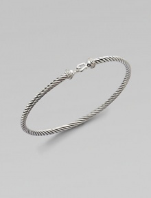From the Cable Collectibles Collection. A sterling silver twisted cable band with diamond pavé detailing along a signature buckle.Diamond, .07 tcw Sterling silver Width, about 3mm Hook closure Imported From the Cable Collectibles Collection. A sterling silver twisted cable band with diamond pavé detailing along a signature buckle.Diamond, .07 tcw Sterling silver Width, about 3mm Hook closure Imported