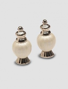 Sand-cast aluminum is handcrafted with artful scallops modeled after peony flower petals, then finished in a trademark blend of enamel and crushed mother of pearl. Set of 2 Engraved signature Each, 4 high Hand wash Made in India Sand-cast aluminum is handcrafted with artful scallops modeled after peony flower petals, then finished in a trademark blend of enamel and crushed mother of pearl. Set of 2 Engraved signature Each, 4 high Hand wash Made in India