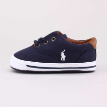The Vaughn is an adorable slip-on canvas sneaker detailed with a lace-up front perfect for your little one.