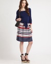 Designed with a nod to nautical, this soft knit pairs a solid top and boldly striped skirt.Ballerina neckline, front and backThree-quarter sleeves with contrast cuffsSelf tie beltSlightly dropped waistPleated skirtPullover styleAbout 21 from natural waist70% viscose/30% polyesterDry cleanImportedModel shown is 5'9½ (176cm) wearing US size Small.