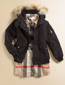 Luxurious golden fox fur trims the hood of this bomber-style parka that lets her enjoy winter while staying warm.Hood with removable golden fox fur trimButton neck tabShoulder epaulettesHidden zip close under button placketZip pocket on one sleeveRibbed knit cuffs and waistFront flap pocketsFully linedCotton/nylonMachine washImportedFur origin: Finland Please note: Number of buttons may vary depending on size ordered. 