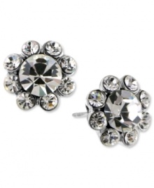 Blooms that sparkle. These 2028 earrings feature glistening glass crystal petals with a large glass crystal center. Crafted in silver tone mixed metal. Approximate diameter: 1/2 inch. Blooms that sparkle. These 2028 earrings feature glistening glass crystal petals with a large glass crystal center. Crafted in silver tone mixed metal. Approximate diameter: 1/2 inch.