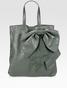 Sumptuous calfskin shaped by an oversized bow for a unique silhouette.Double top handles, 6½ dropTop snap closureInner zip pouchSuede lining13¼W X 15½H X 2DMade in Italy