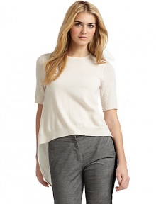 THE LOOKShort, open-knit sleevesRibbed cuffs and hemKnit cashmere front; woven silk backBack button closureTuxedo shirttail backAsymmetric, side-split hemTHE FITAbout 30 from shoulder to longest point of hemTHE MATERIALFront: cashmereBack: silkCARE & ORIGINDry cleanImportedModel shown is 5'10 (177cm) wearing US size Small. 