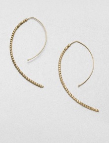 Delicate faceted beads line up along the arc of an artfully shaped hoop with a modern appeal.14k yellow goldLength, about 2Hoop wireMade in USA Delicate faceted beads line up along the arc of an artfully shaped hoop with a modern appeal.14k yellow goldLength, about 2Hoop wireMade in USA