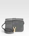 Shoulder style in luxe patent leather with signature golden hardware.Adjustable buckle shoulder strap, 20-22 drop Magnetic flap closure One inside zip pocket Cotton lining 3W X 6½H X 9½D Made in Italy