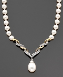 A pièce de résistance; this stunning necklace features cultured freshwater pearls (8-10 mm) and round-cut diamonds (1/10 ct. t.w) set in 14k gold and sterling silver. Approximate length: 17 inches. Approximate drop: 1-1/2 inches. A pièce de résistance; this stunning necklace features cultured freshwater pearls (8-10 mm) and round-cut diamonds (1/10 ct. t.w) set in 14k gold and sterling silver. Approximate length: 17 inches. Approximate drop: 1-1/2 inches.