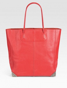 A classic leather tote in a chic look-at-me hue.Double top handles, 7¾ dropProtective metal feetTwo open inner compartmentsOne inner zip pouch12W X 13¼H X 4¼DImported A classic leather tote in a chic look-at-me hue.Double top handles, 7¾ dropProtective metal feetTwo open inner compartmentsOne inner zip pouch12W X 13¼H X 4¼DImported