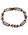 Refresh your look. Givenchy's alluring flex bracelet features silk Swarovski stones. Set in brown gold tone mixed metal. Approximate length: 7-1/4 inches.