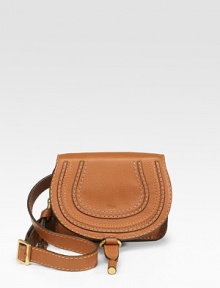Classic travel essential in soft leather, detailed with contrast topstitching and tonal leather trim at the flap.Adjustable waist strap, 30-36 Flap with buckle and inside zip closure One inside open pocket One inside credit card slot Cotton lining 6W X 5H X 1½D Imported Classic travel essential in soft leather, detailed with contrast topstitching and tonal leather trim at the flap.Adjustable waist strap, 30-36 Flap with buckle and inside zip closure One inside open pocket One inside credit card slot Cotton lining 6W X 5H X 1½D Imported