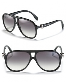 Turn heads in Alexander McQueen's fashionable aviators with metal skull embellishments at temples.