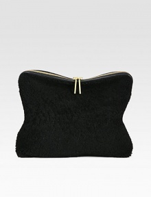 Luxurious shearling and leather design in a simple and elegant style, perfect for day to night.Convertible top handle strap, 1 dropTop zip closureOne inside zip pocketFully lined15W X 8H X 3½DImported Luxurious shearling and leather design in a simple and elegant style, perfect for day to night.Convertible top handle strap, 1 dropTop zip closureOne inside zip pocketFully lined15W X 8H X 3½DImported